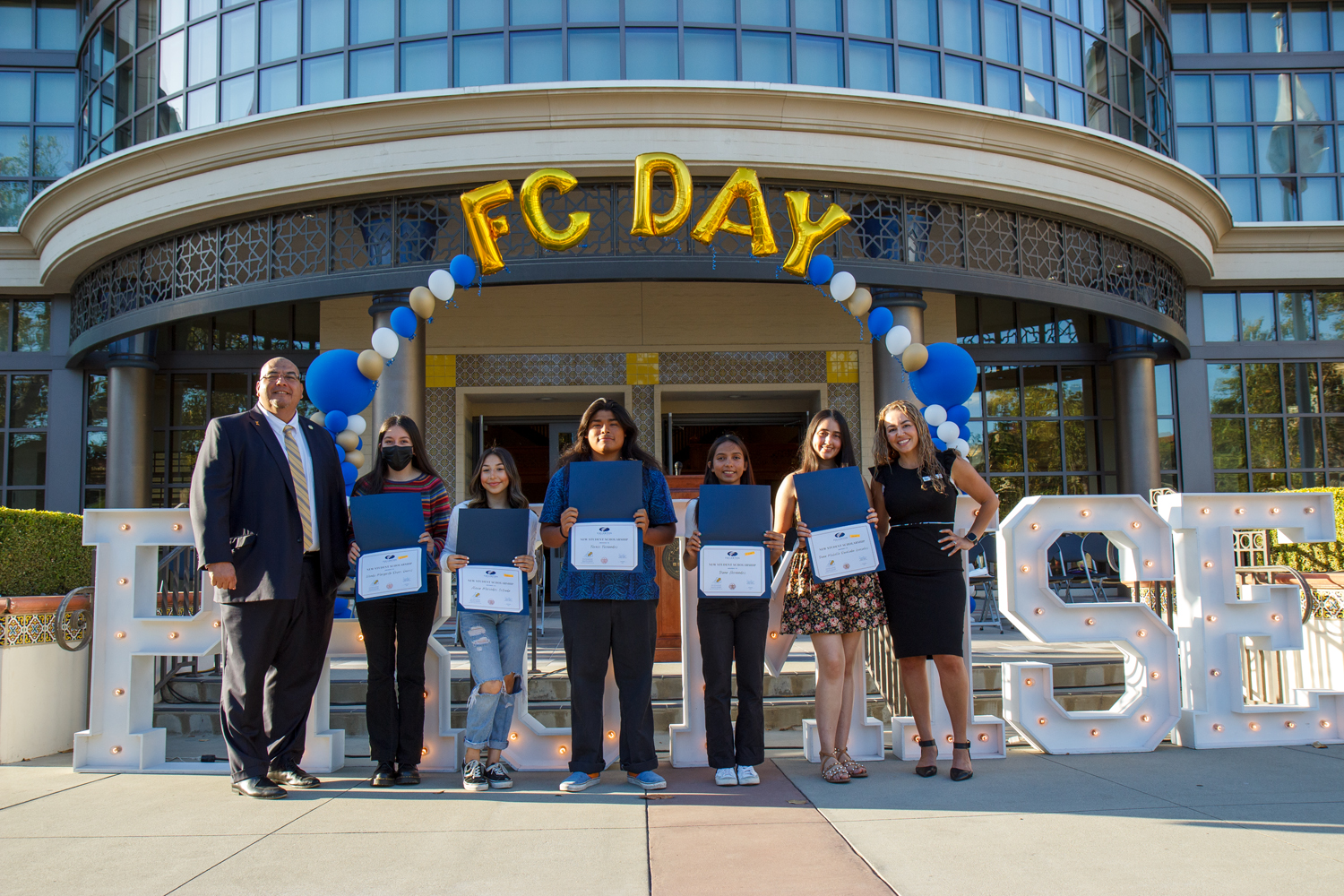Students with scholarship certificates during FC Future Hornet Celebration 2022
